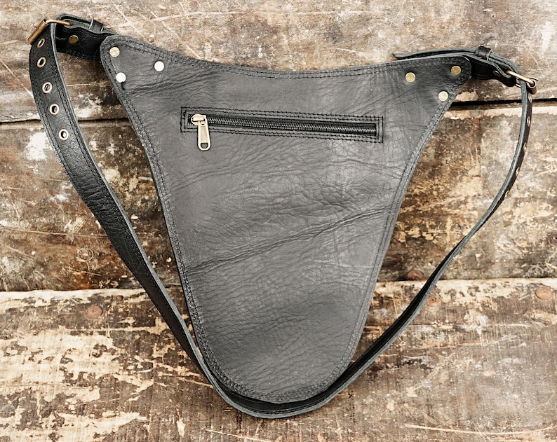 A stylish bag that holds small tools and supplies like rulers