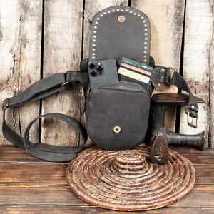 Leather waist pouch with brass studs and durable belt design