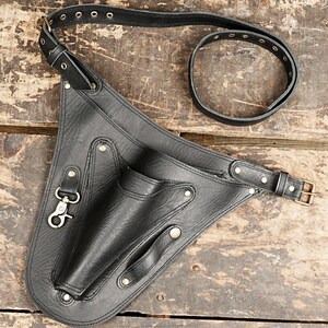 Leather Tool Bag - Sturdy bag for storing tools like hammers, knives, and prying tools.