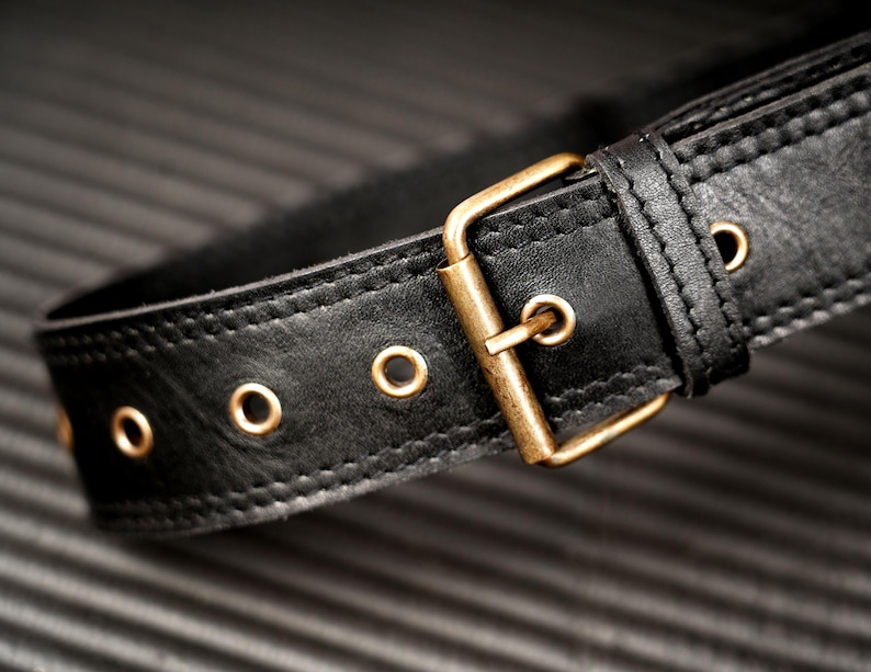Black leather sling bag and crossbody waist pack with zippered compartments