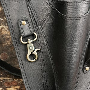Leather Tool Bag - Sturdy bag for storing tools like hammers, knives, and prying tools.