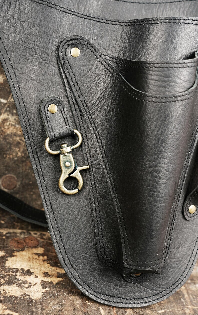 Leather Tool Bag - Sturdy bag for storing tools like hammers, knives, and prying tools.