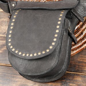 Handmade leather hip bag with adjustable strap and rivet accents