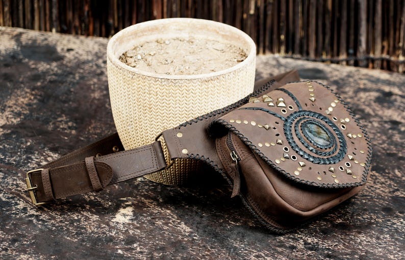 Bohemian leather hip pouch with gemstone centerpiece and unique handcrafted pattern.