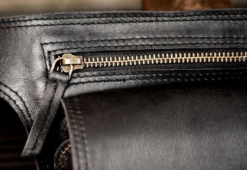 Black full-grain leather utility belt bag for hands-free travel and everyday carry