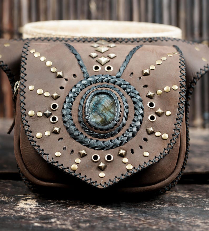 Genuine leather hip pouch with gemstone accent, brass studs, and boho design.