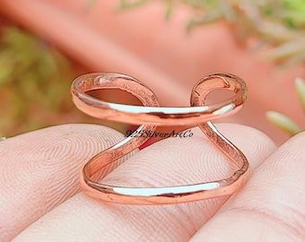 Massief koperen dubbele knokkelring: gedraaide spalksieraden
