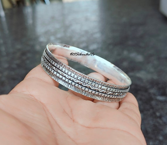 Sterling Silver Spinner Bangle: Handcrafted Textured Cross Design