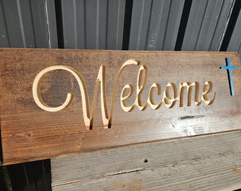 Letrero de bienvenida con cruz