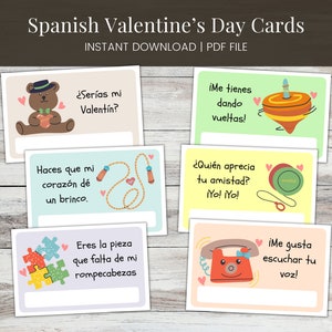 May include: A collection of Spanish Valentine's Day cards with various illustrations and phrases. The cards feature images of a teddy bear, spinning top, jump rope, puzzle pieces, and a telephone. Each card has a blank space for a personalized message.