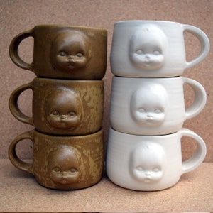 Kusliga babyansiktsskålar och muggar