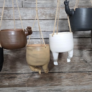 Macetas colgantes grandes con forma de bebé espeluznante