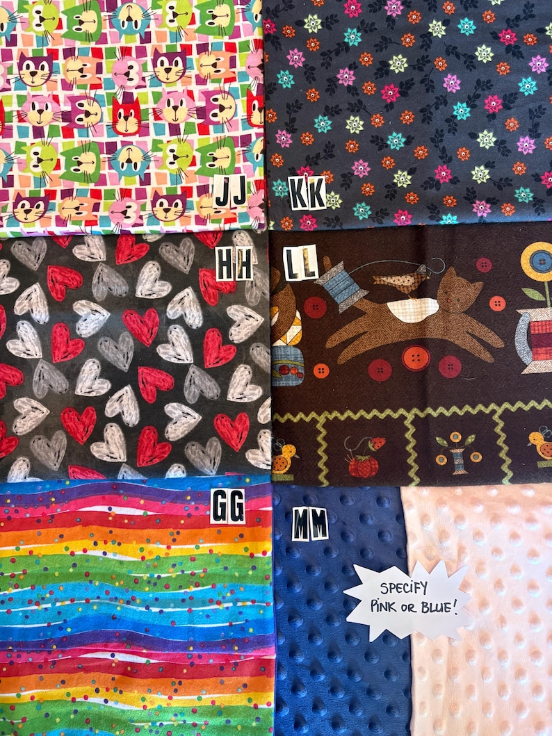 May include: A collection of six fabric swatches labeled JJ, KK, HH, LL, GG, and MM. Patterns include colorful cat faces, small floral prints, red and white hearts, a brown cat with sewing motifs, rainbow stripes, and dimpled minky fabric in blue or pink.