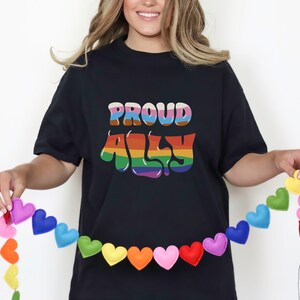 プライド T シャツ、プラウド アリー T シャツ、ゲイ プライド T シャツ、プライド フェスティバル シャツ、LGBTQIA+ T シャツ、レインボー T シャツ