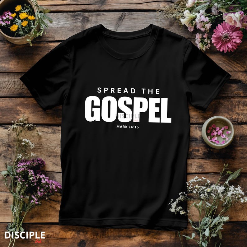 May include: A black short-sleeved t-shirt featuring white text that reads SPREAD THE GOSPEL and MARK 16:15. The shirt has a crew neckline and a standard fit, with the graphic printed in a bold, sans-serif font centered on the chest area.
