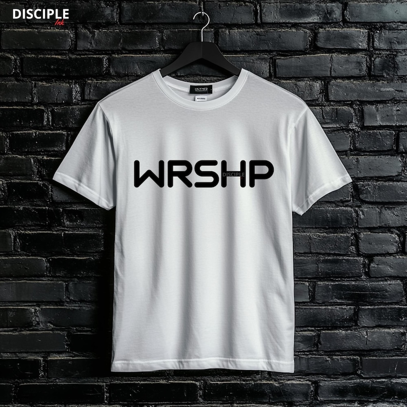 May include: White t-shirt with black text that reads "WRSHIP" with the word "DISCIPLE" in smaller font underneath.