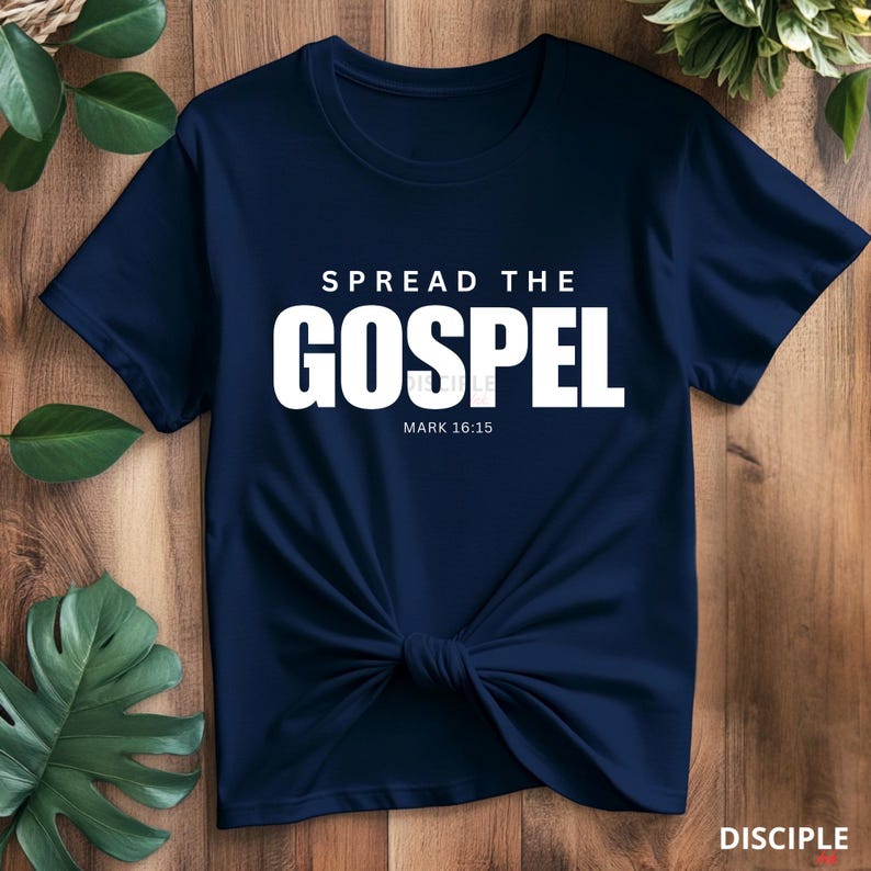 May include: A navy blue t-shirt with white text that reads "Spread the Gospel" and "Mark 16:15".
