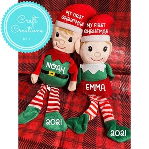 May include: Two personalized plush elf ornaments with red and green outfits. The elf on the left has the name "Noah" and the text "My First Christmas 2021". The elf on the right has the name "Emma" and the text "My First Christmas 2021".