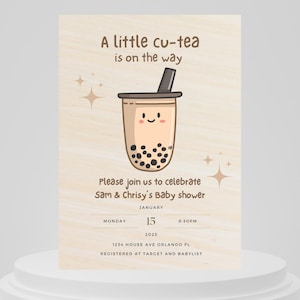 May include: A baby shower invitation with a cartoon illustration of a boba tea cup with a smiling face. The text reads "A little cu-tea is on the way". The invitation includes the date, time, and location of the event.