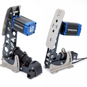May include: Two racing simulator pedals. The pedals have a dark gray frame with silver-colored footplates. The motors are black and blue with the brand name "SIMSONN" printed on them. The pedals are designed for sim racing.