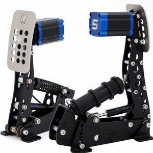 May include: A pair of black and silver racing pedals with blue accents. The pedals have a perforated silver footplate and a black frame with visible springs and bolts. The top of each pedal has a blue and black component with a white logo.