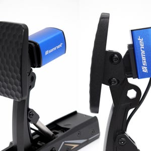 May include: Two black and blue racing pedals with the "simnet" logo. The pedal on the left has a textured surface. The blue components have the "simnet" logo in white.