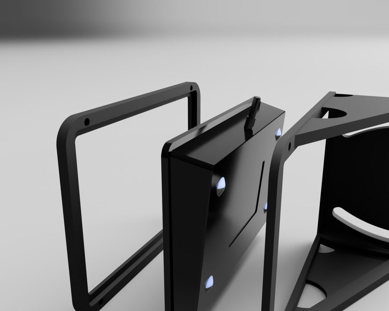 May include: A black, geometric product design with a rectangular frame, a central component with blue accents, and a triangular support structure. The design appears to be a component of a larger product, possibly a stand or a housing.
