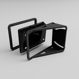 May include: A black, geometric, three-dimensional object with a rectangular frame and a triangular base. The object has a modern, minimalist design, with a handle on top. The object appears to be made of metal or a similar material.