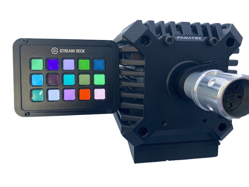May include: A black Stream Deck with multi-colored buttons is attached to a black Fanatec device. The Stream Deck has the logo and text "STREAM DECK" on it. The Fanatec device has the text "FANATEC" on it.
