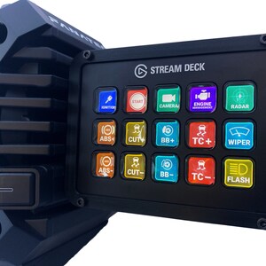 May include: Black Stream Deck control panel with illuminated buttons. The panel features buttons labeled "IGNITION", "START", "CAMERA", "ENGINE MANAGEMENT", "RADAR", "ABS+", "CUT+", "BB+", "TC+", "WIPER", "ABS-", "CUT-", "BB-", "TC-", and "FLASH".