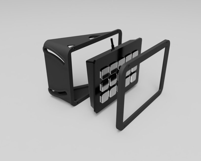 May include: A black electronic device with a grid of silver buttons, disassembled to show its components. The device has a sleek, modern design with a black frame and a triangular base.