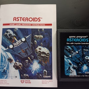Vintage Asteroids Atari 2600 Video Game Cartridge and Manual.