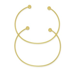 May include: Two gold-colored, open-ended cuff bracelets. Each bracelet has a circular design with a small, round ball at each end. The bracelets are displayed on a white background.