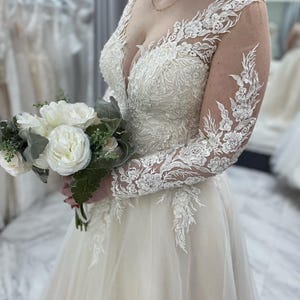 Ivory laced long sleeves A-line wedding gown with train corset back wedding dress Size 8-10