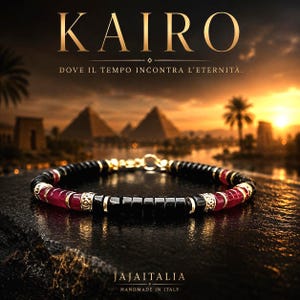 May include: A beaded bracelet featuring alternating black and translucent red cylindrical beads, accented with gold-toned metal spacers and a gold-toned clasp. The text KAIRO, DOVE IL TEMPO INCONTRA L'ETERNITÀ, JAJAITALIA, and HANDMADE IN ITALY is visible.