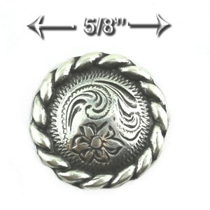 May include: Silver-toned metal button with a rope-like border and an engraved floral design. The button measures 5/8 inches in diameter.