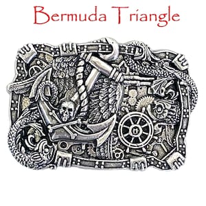 May include: Silver belt buckle with a detailed design of a skull, anchor, wings, and gears. The buckle is engraved with the words "Bermuda Triangle".