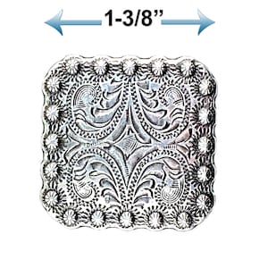 May include: Silver-toned metal square buckle with an intricate floral design and a scalloped edge. The buckle measures 1-3/8 inches in width.