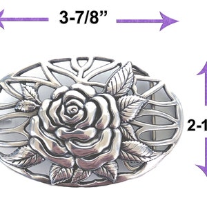 May include: Silver-toned metal belt buckle with a detailed rose design. The buckle measures 3-7/8 inches wide and 2-1/2 inches tall.