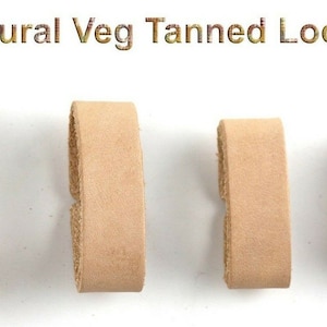 May include: Four natural veg tanned leather loops of different sizes. The loops are all the same color, a light brown.