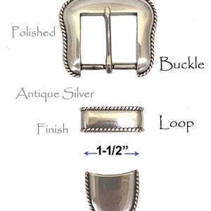 May include: Silver buckle set with a rope edge design. The buckle is 1-1/2 inches wide. The set includes a buckle, loop, and tip.