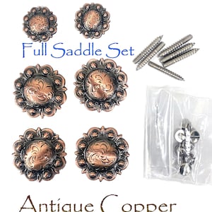 May include: Antique copper full saddle set with decorative floral design. Includes six conchos, screws, and washers. The text "Full Saddle Set" and "Antique Copper" are visible.