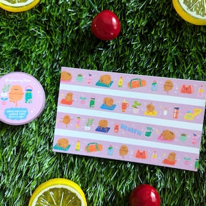 May include: A roll of pink washi tape and a rectangular sheet of stickers featuring a cartoon potato doing yoga and other wellness activities. The tape reads "Yoga Potato Washi Tape" and the stickers have the word "Health".