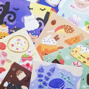 May include: A set of 10 colorful illustrated cards featuring various sweet treats, including a cake with a swirl of frosting, a strawberry sundae, a pastry with a swirl of frosting, a lavender flower arrangement, and a blue macaron.