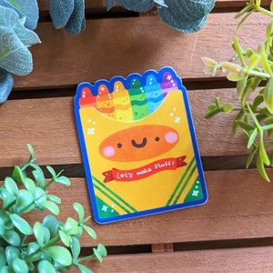 May include: A colorful sticker of a box of crayons with a smiling face and the text "Let's make stuff!" The crayons are arranged in a rainbow pattern.