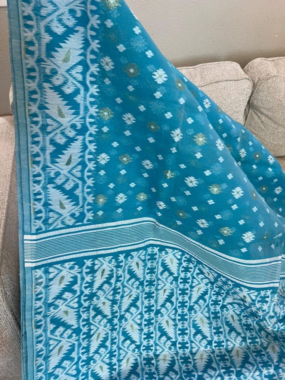 Maslin Jamdani Saree In Sky Blue Color With White And Golden  Buta.