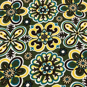 Fabric-“hot Blossom” #8880 by Josephine Kimberling for Robert Kaufman.Brown,yellow and turquoise stylized blossoms on green background.