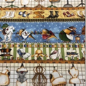 May include: Fabric with a repeating pattern of dress forms, shoes, hats, and cartoon birds. The background is a grid pattern with a measuring tape border. Colors include beige, blue, green, and brown.