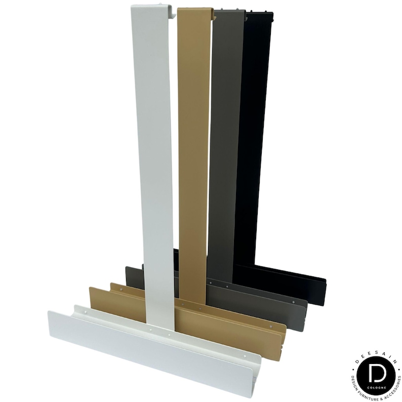 May include: A set of four vertical metal over-the-door hooks in white, gold, gray, and black. Each hook features a long, flat, rectangular vertical arm with a small top hook and a wider, horizontal base tray for storage or display purposes.