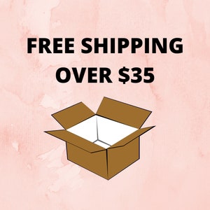 May include: A brown cardboard box with open flaps, set against a pink watercolour background. The text "FREE SHIPPING OVER $35" is displayed in bold black font above the box.
